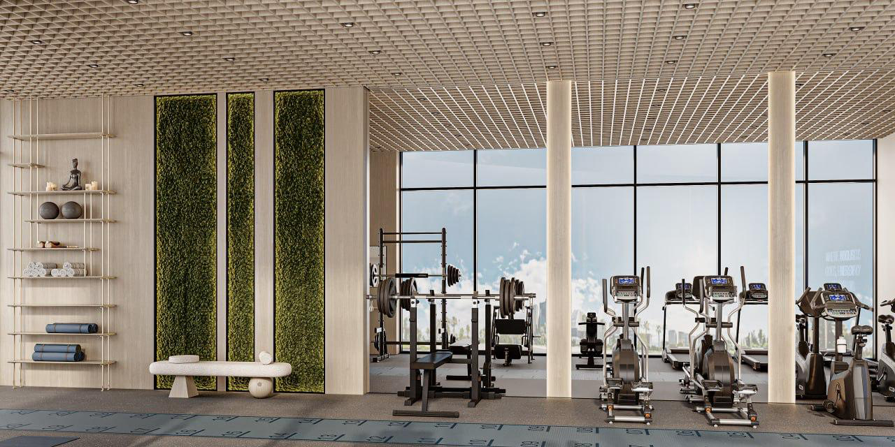 Cove Grand By Imtiaz Modern gym interior featuring workout equipment, large windows, greenery, and a calming atmosphere.